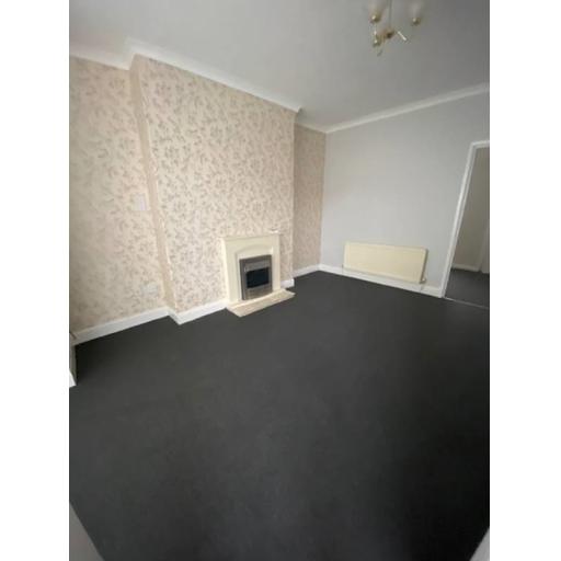 High yielding tenanted property in the North East West View living room.jpg